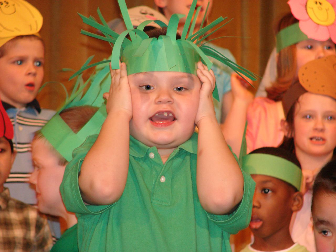 photo: child covering his ears by Counselman Collective